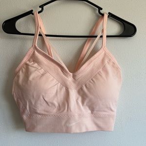 Light pink Nike sports bra. Thick and provides a lot of hold. Size xl